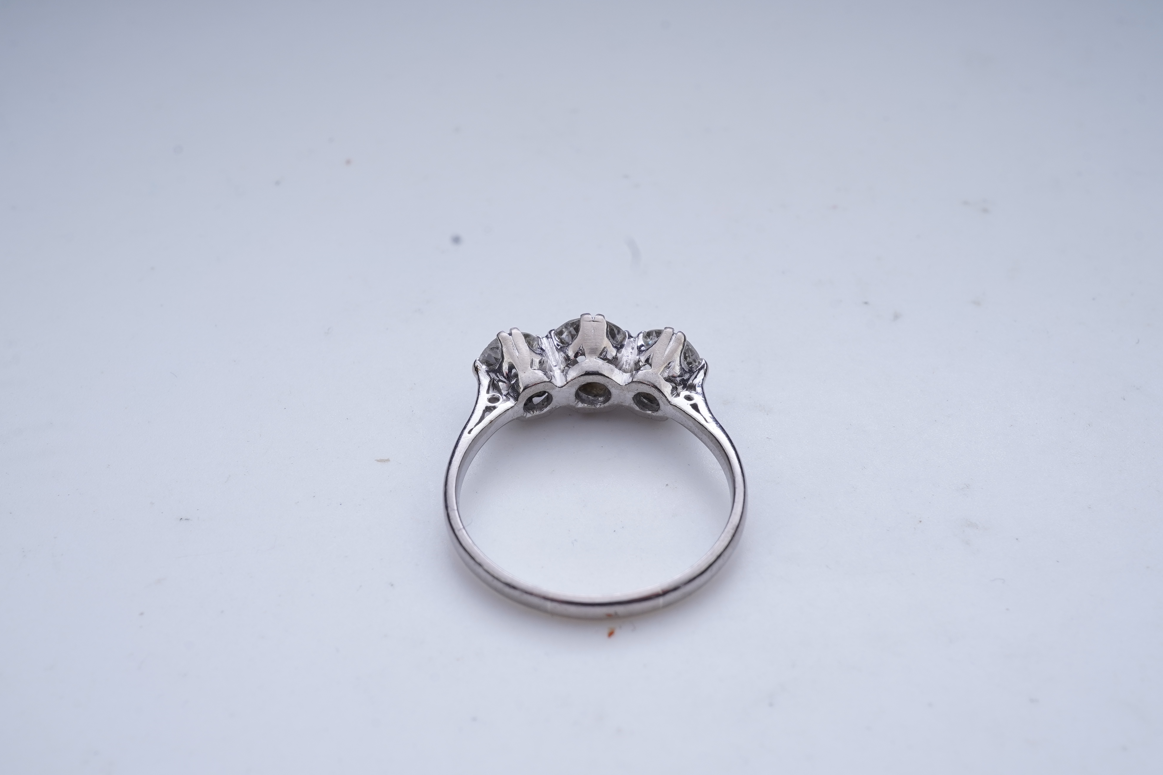 A three-stone diamond ring, early 20th century
